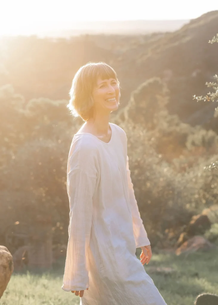 woman walking in sunlight during spiritual healing journey